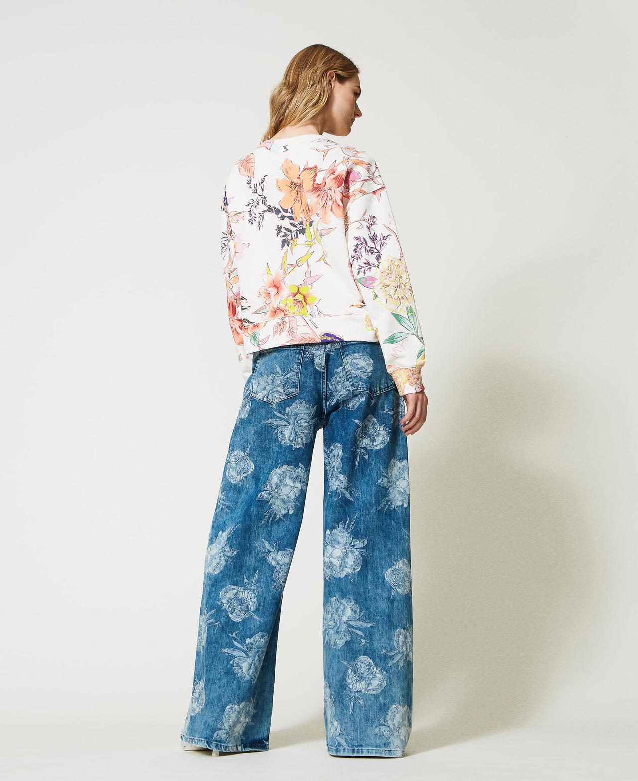 Jeans wide leg con stampa rose