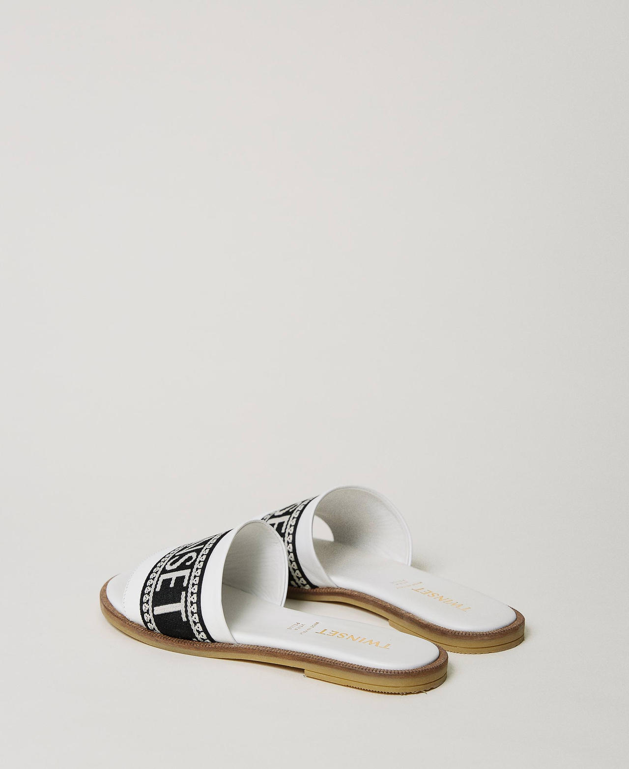 Slides with jacquard logo