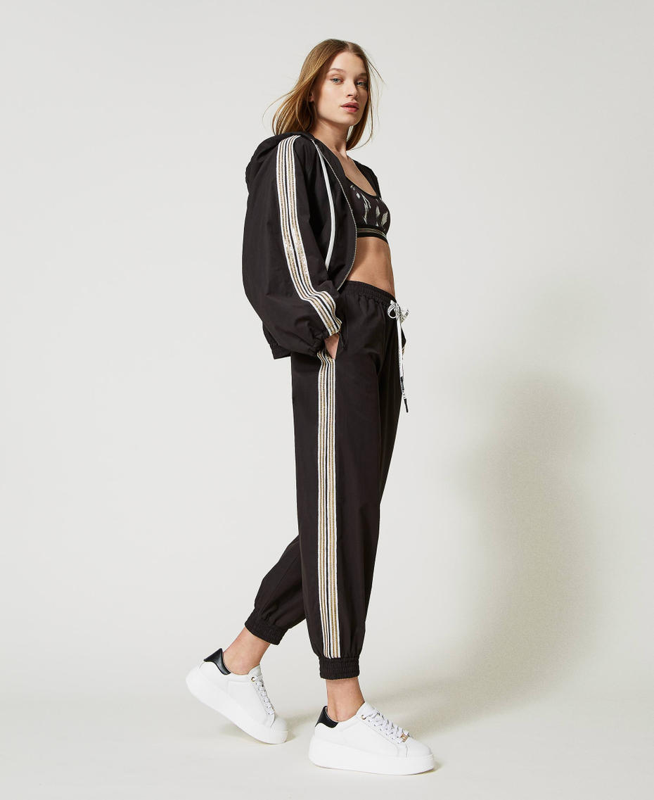 Joggers with sequin embroidery