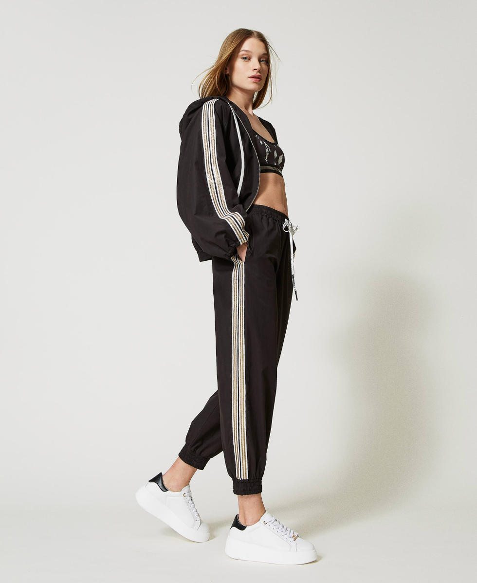 Joggers with sequin embroidery