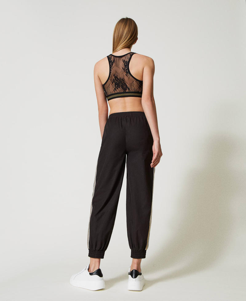 Joggers with sequin embroidery