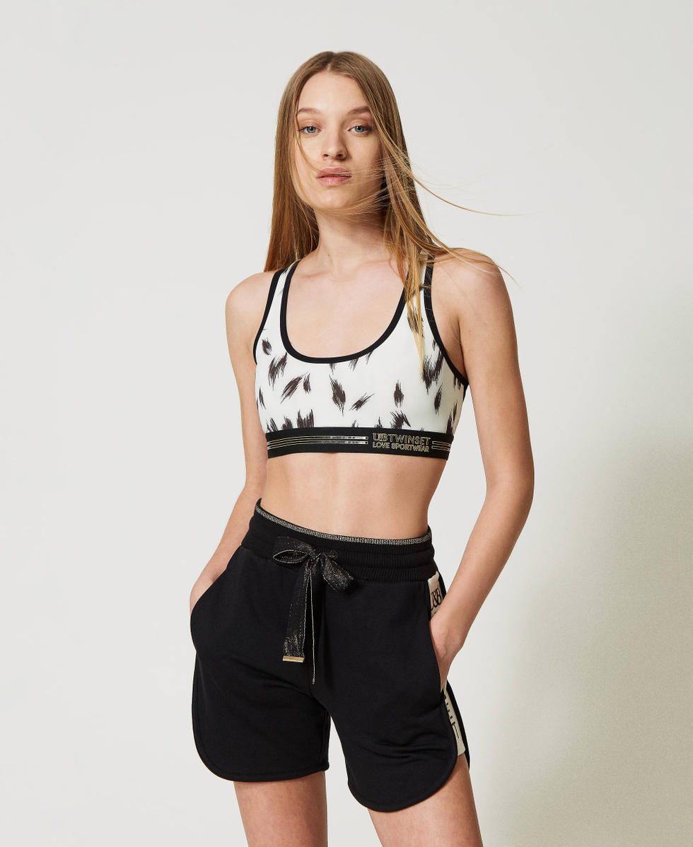 Shorts con nastro e dettagli dorati