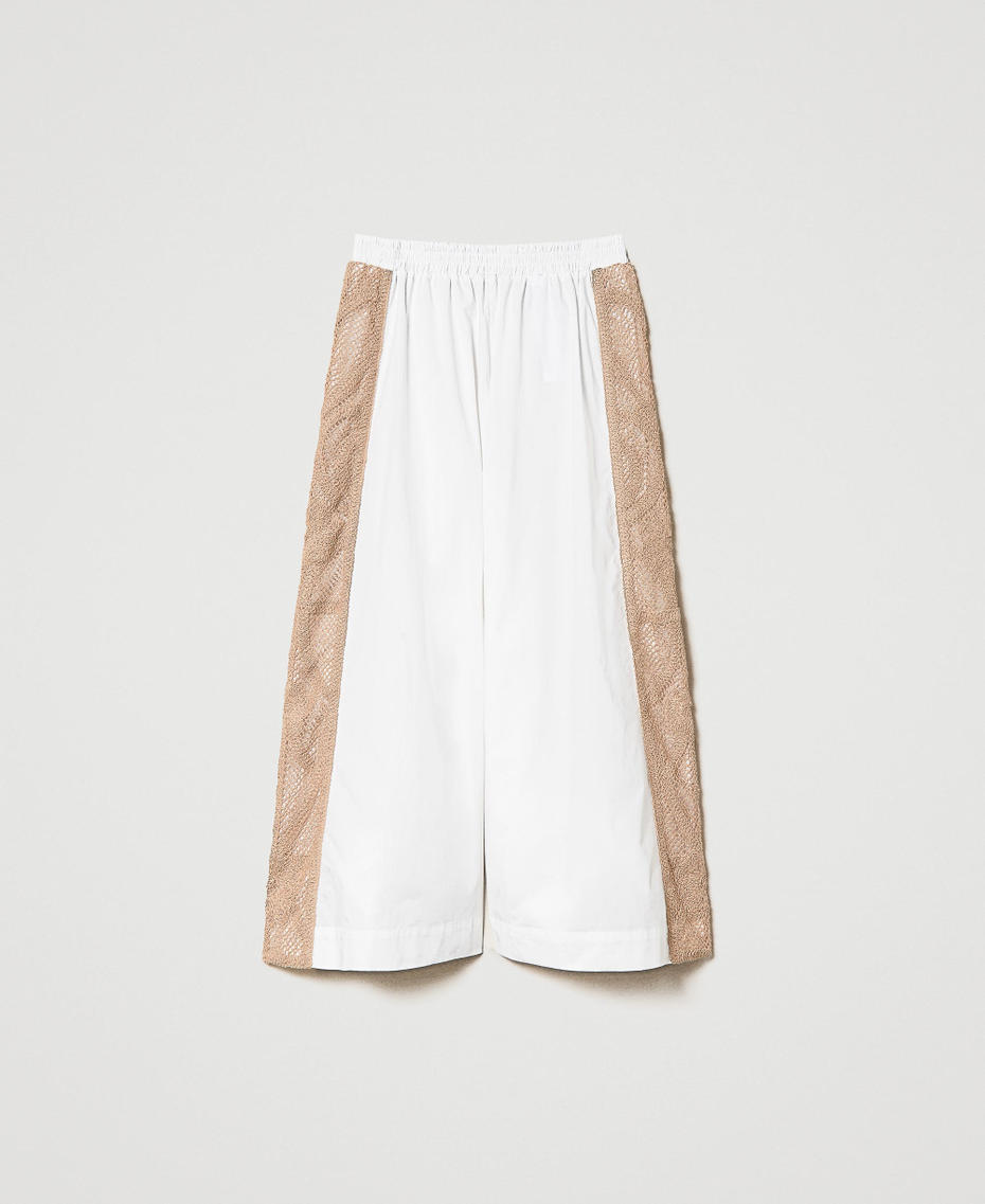 Cropped trousers with macram&eacute; lace bands