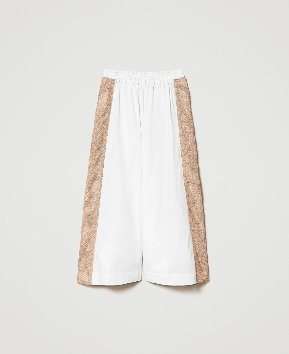 Cropped trousers with macram&eacute; lace bands