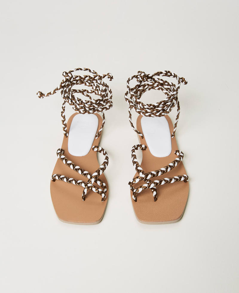 Flat thong sandals with weaved laces