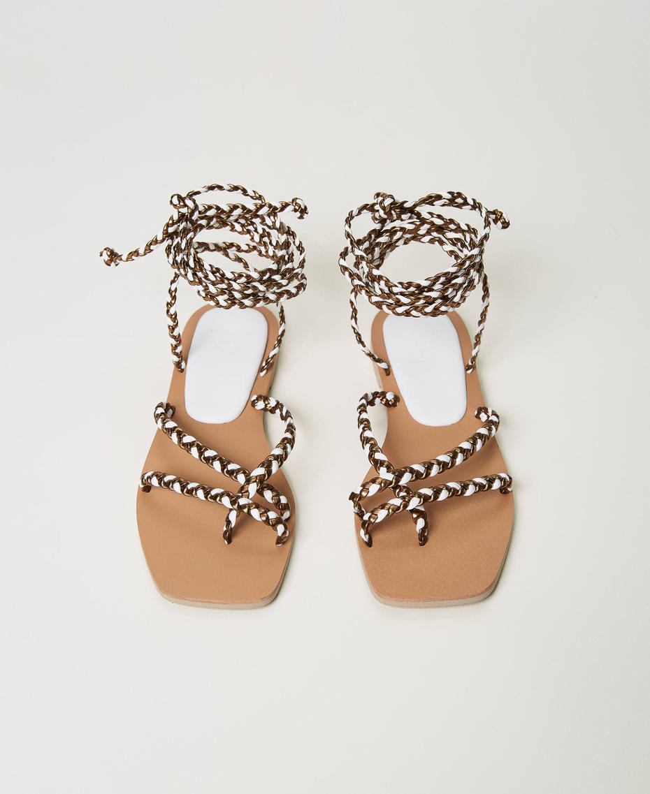 Flat thong sandals with weaved laces
