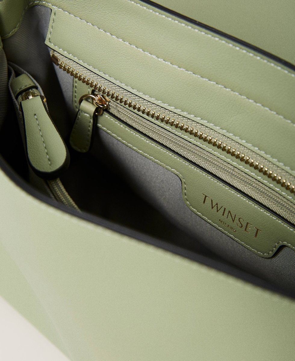 Top handle bag with torchon chains