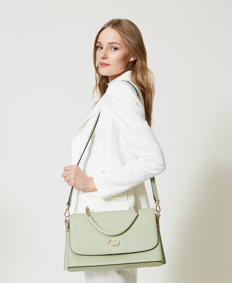 Top handle bag with torchon chains