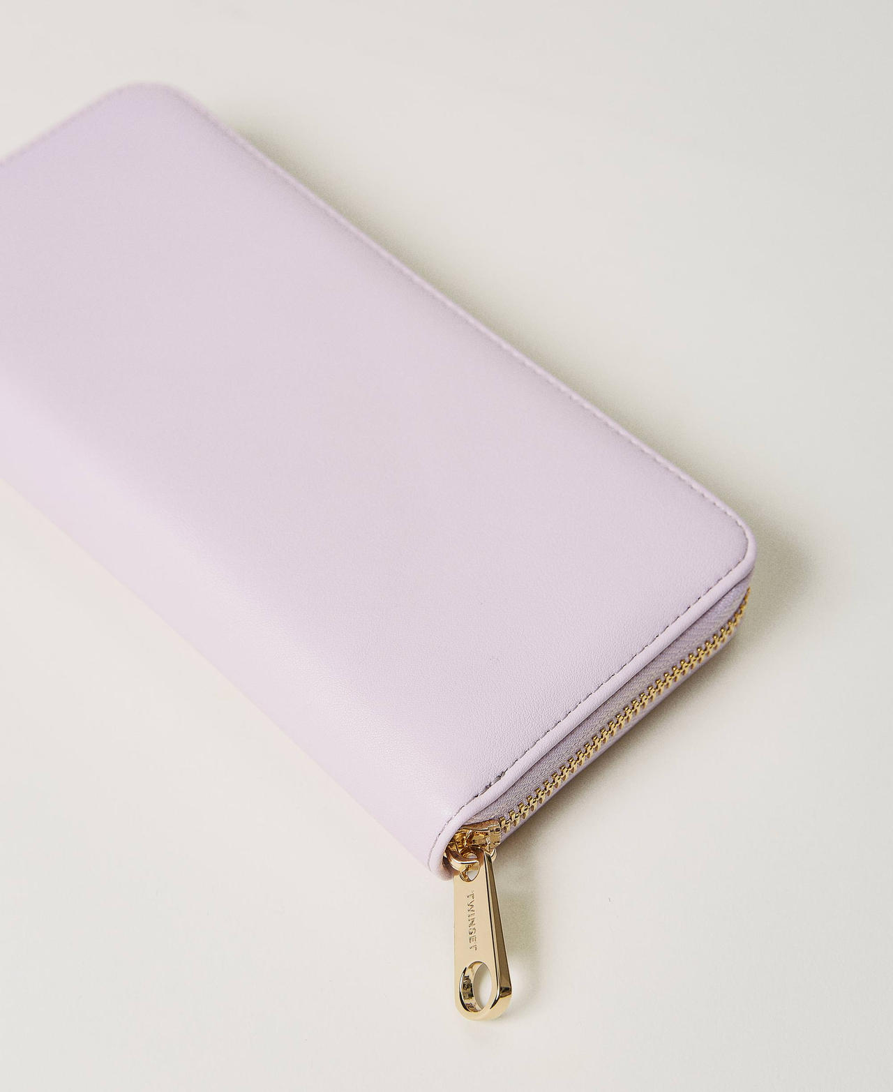 Leather-like wallet with metal Oval T
