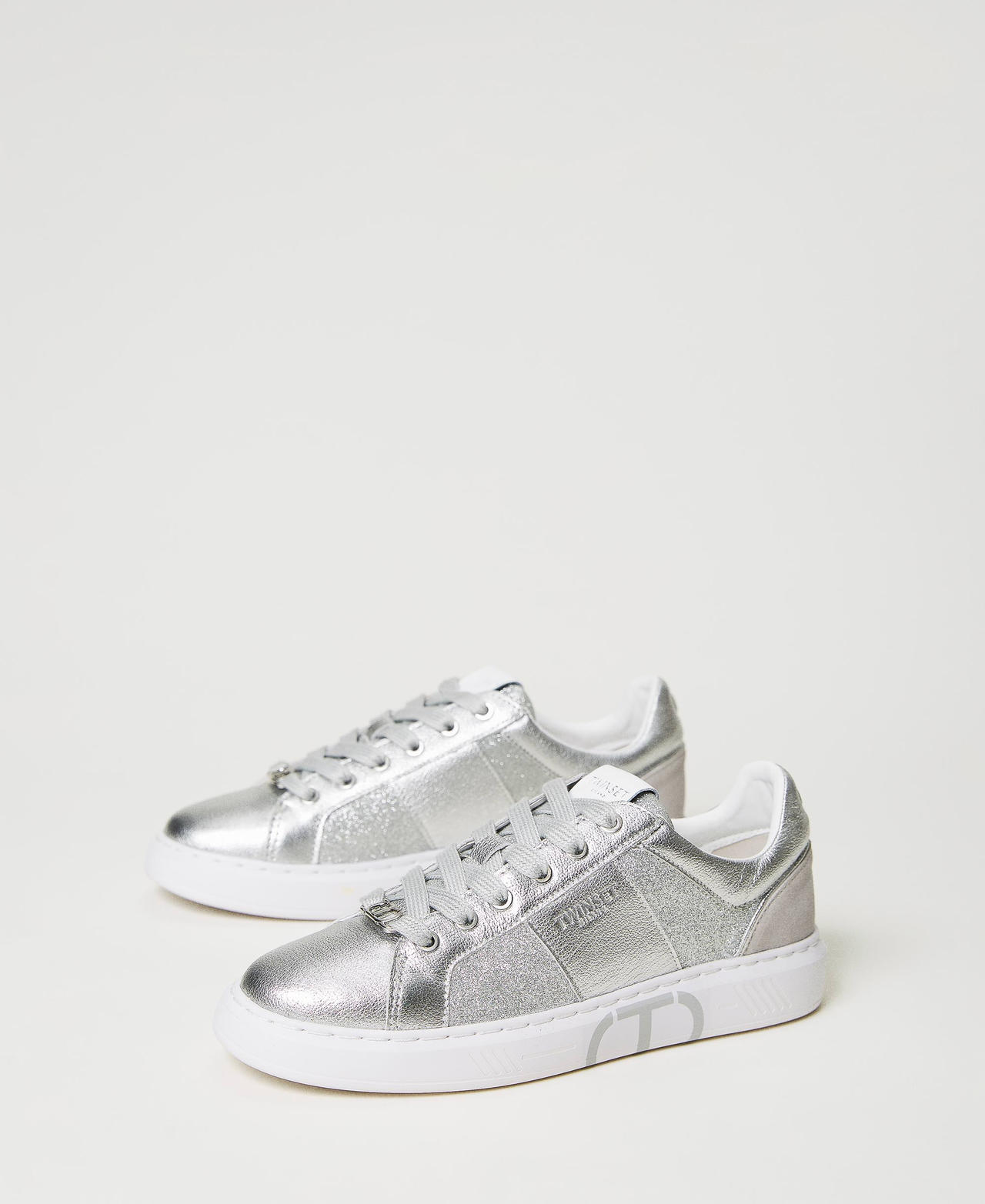 Laminated trainers with glitter inserts