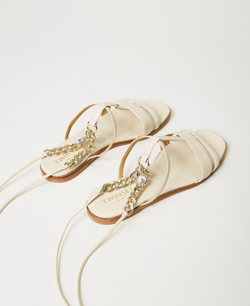 Leather sandals with chain ankle strap