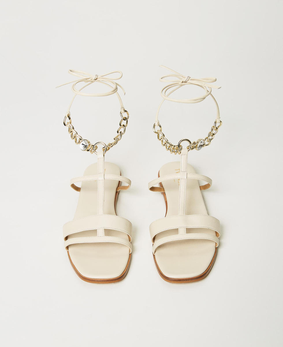 Leather sandals with chain ankle strap