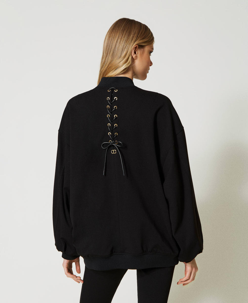 Bomber avec finition tress&eacute;e et &oelig;illets