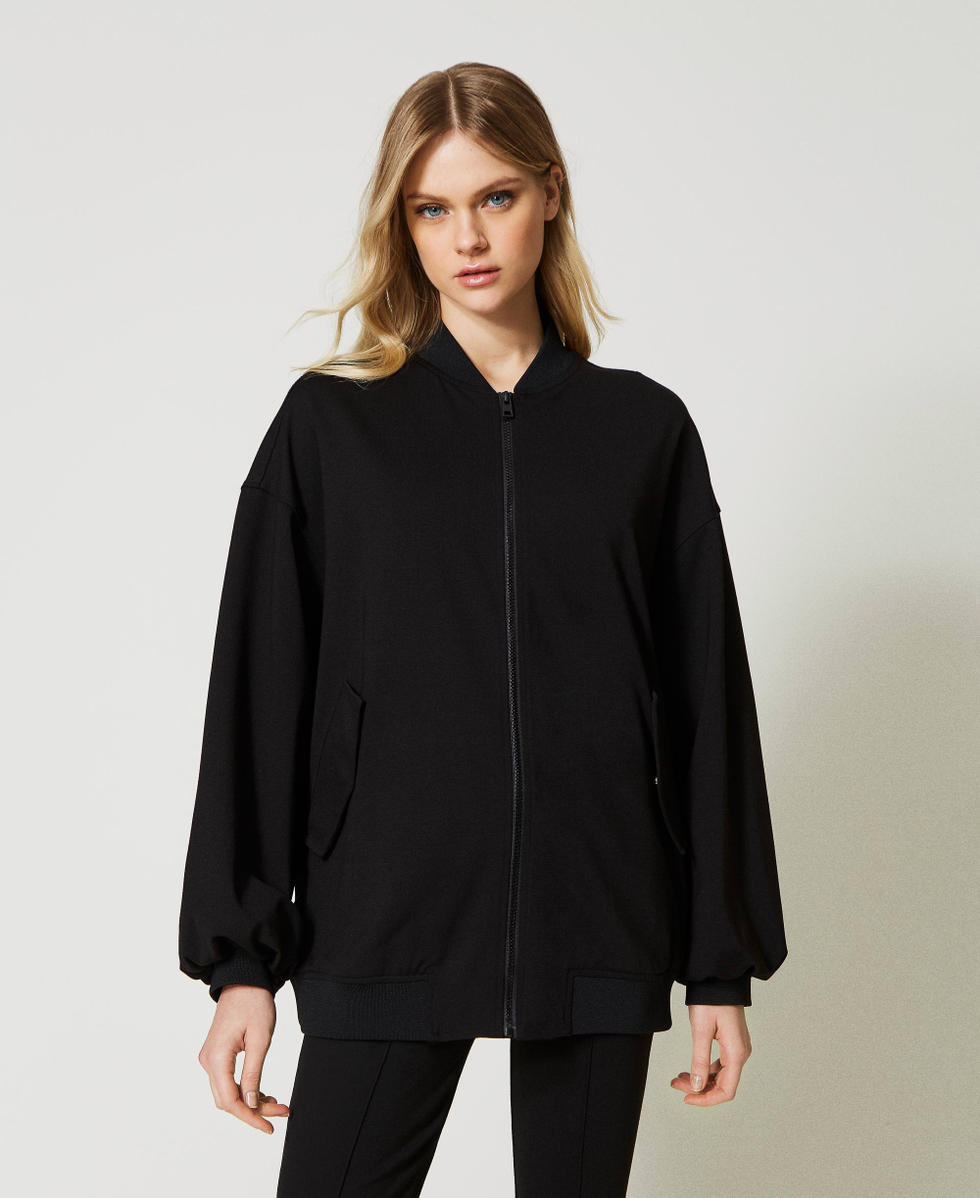 Bomber avec finition tress&eacute;e et &oelig;illets