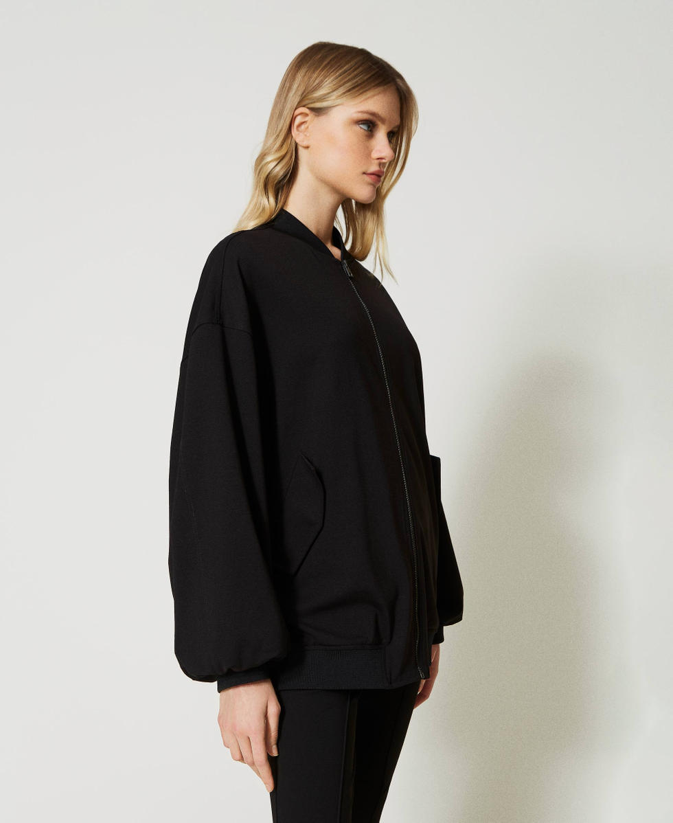 Bomber avec finition tress&eacute;e et &oelig;illets