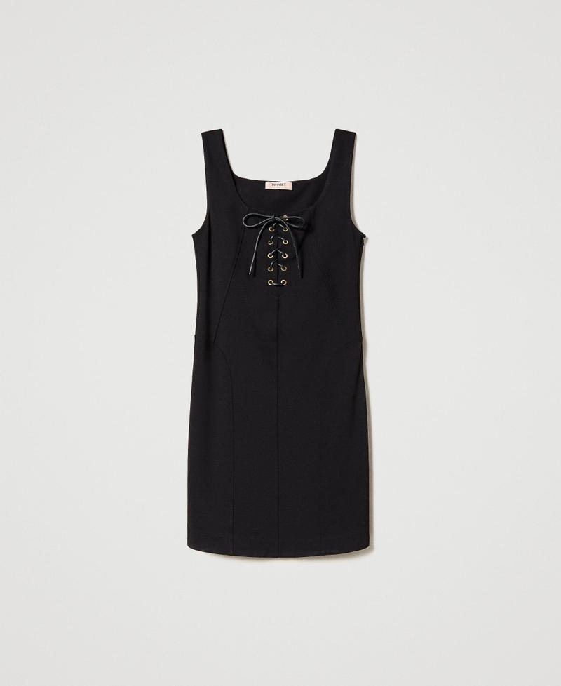 Dress with eyelets and weaving