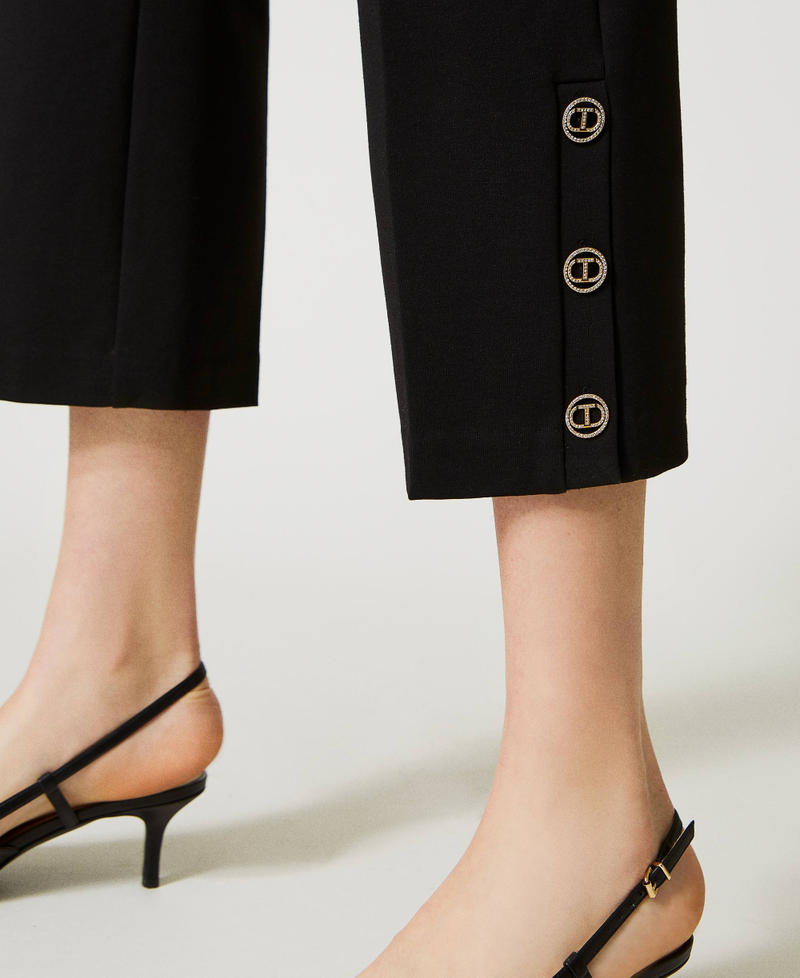 Cropped trousers with Oval T buttons