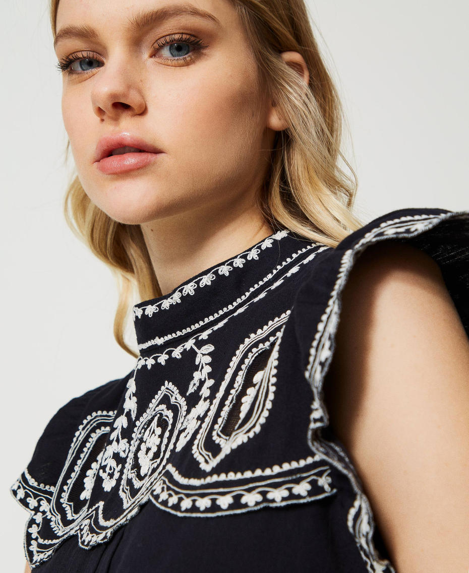 Top with contrasting embroideries