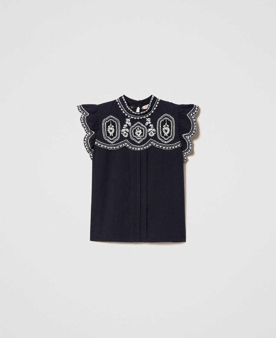 Top with contrasting embroideries