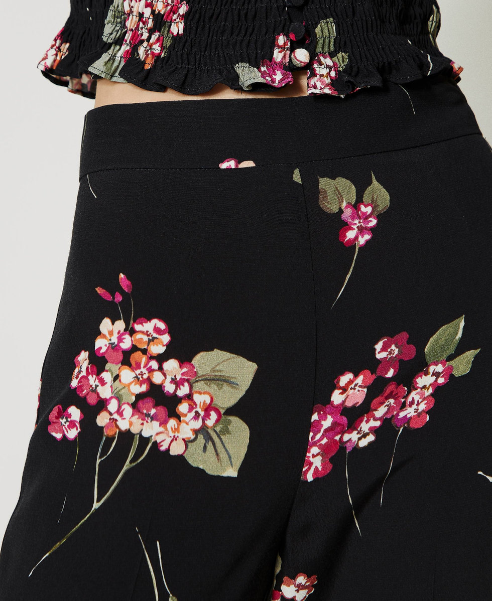 Flared floral crêpe trousers Woman, Black