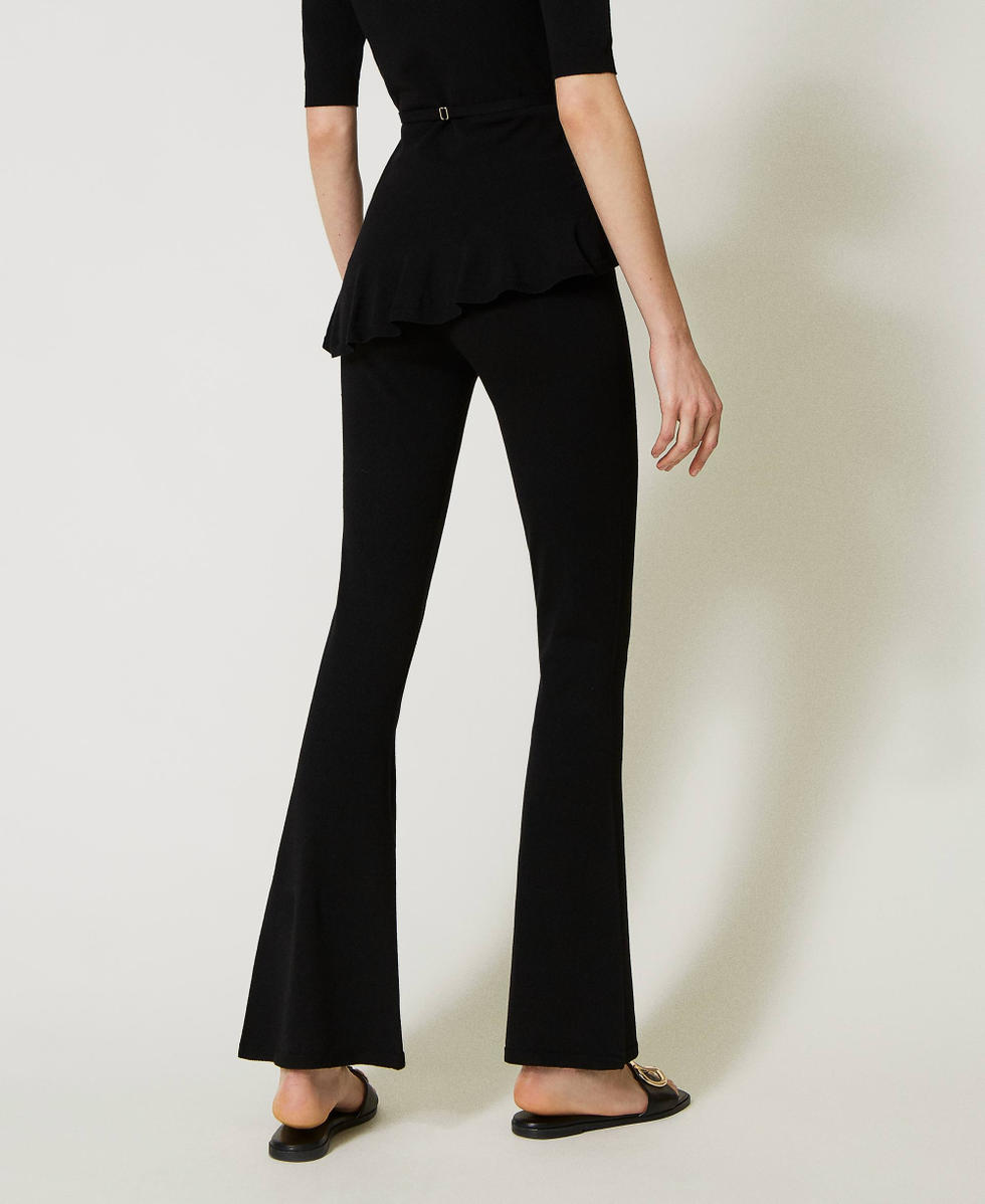 Flared seamless knit trousers