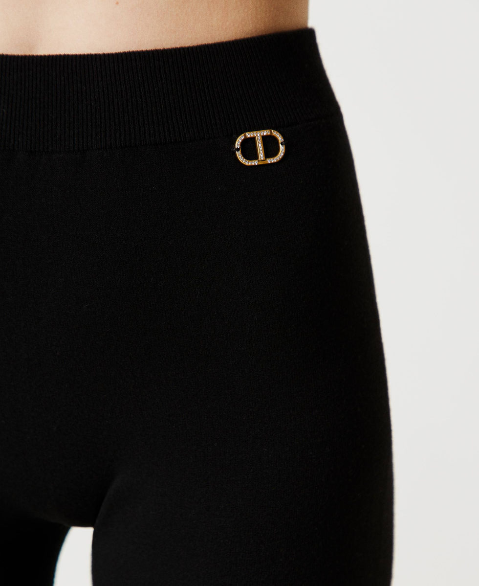 Flared seamless knit trousers