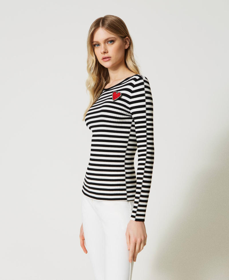 Striped top with brooch