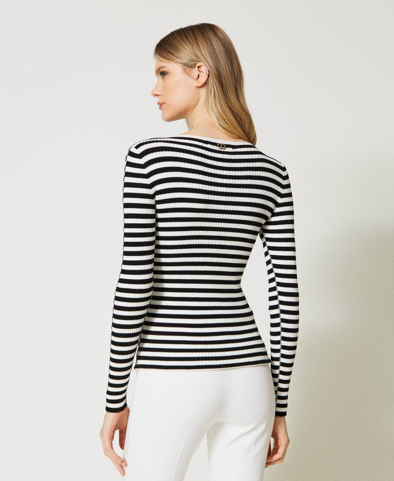 Striped top with brooch
