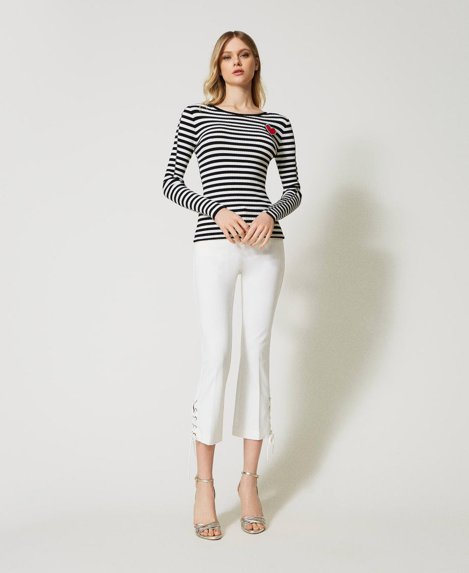 Striped top with brooch