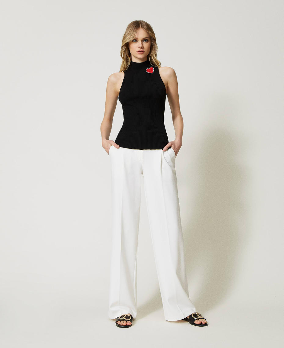 Gestreiftes Stricktop mit Brosche Schwarz Frau 231TP3291_00006_T0