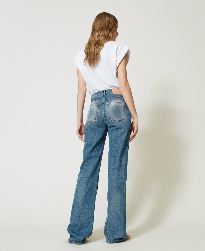 Jeans flare 'Dalia' con petali effetto pelle