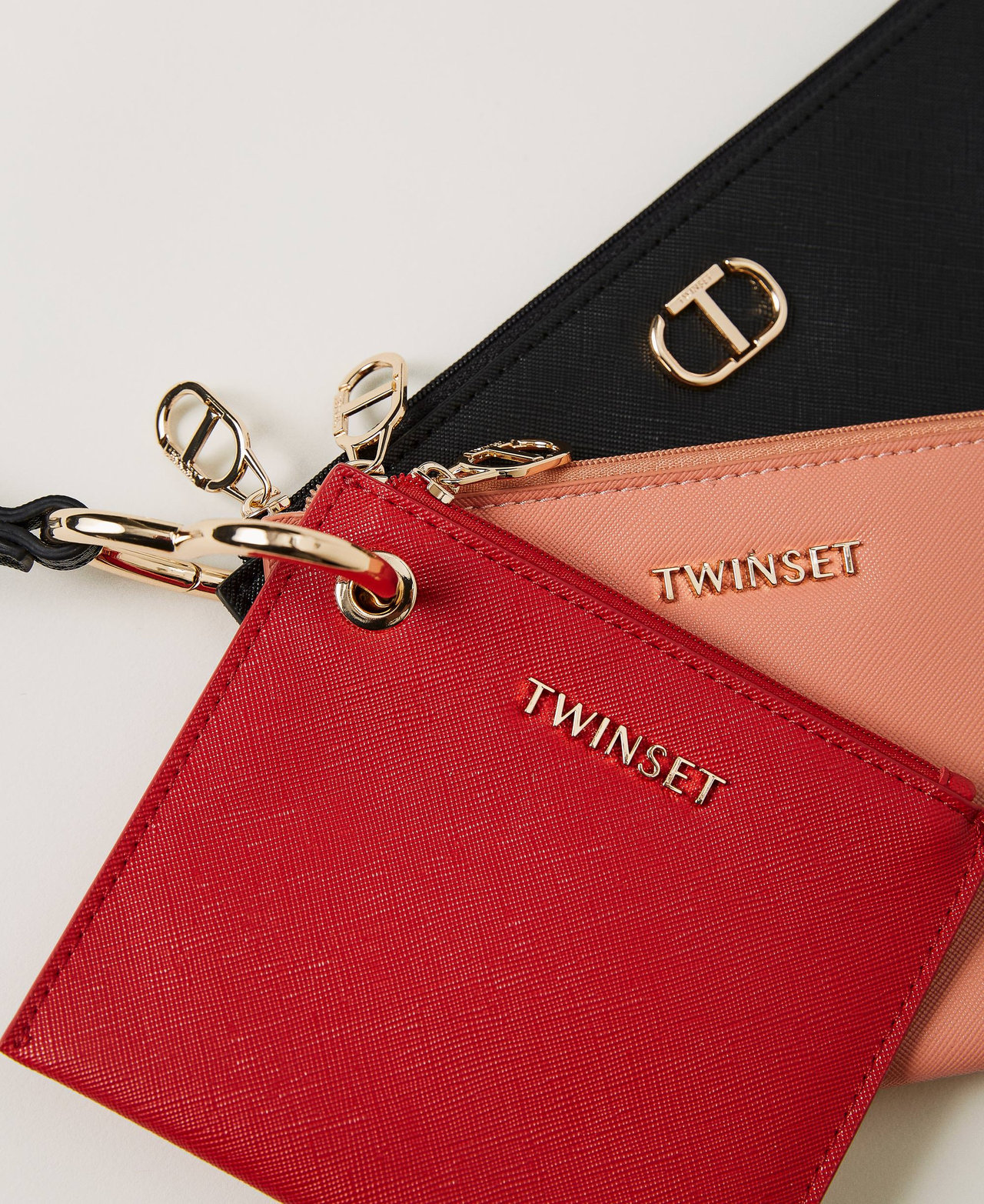 Trio of pouches with Oval T