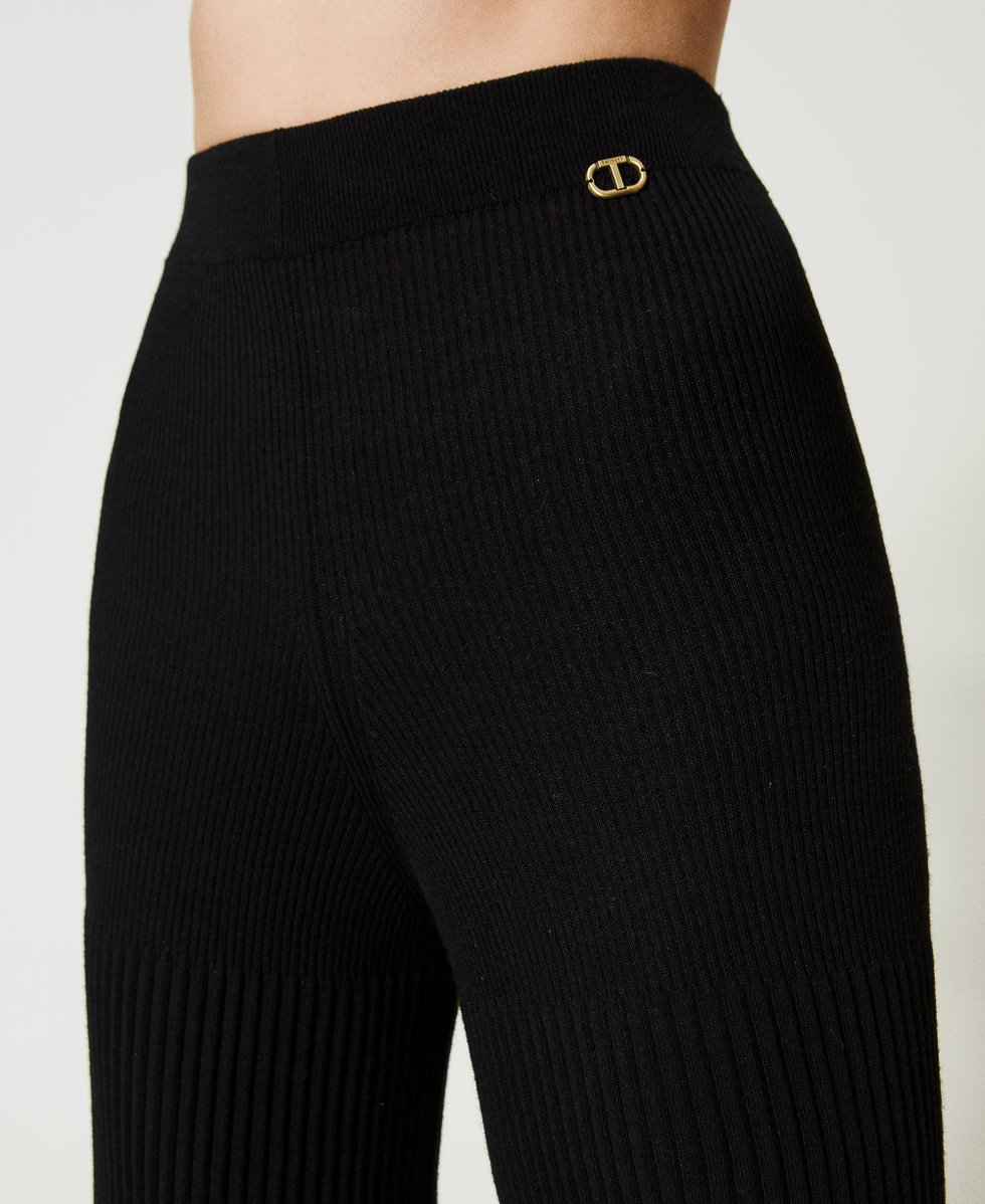 Pantalones palazzo con plisados