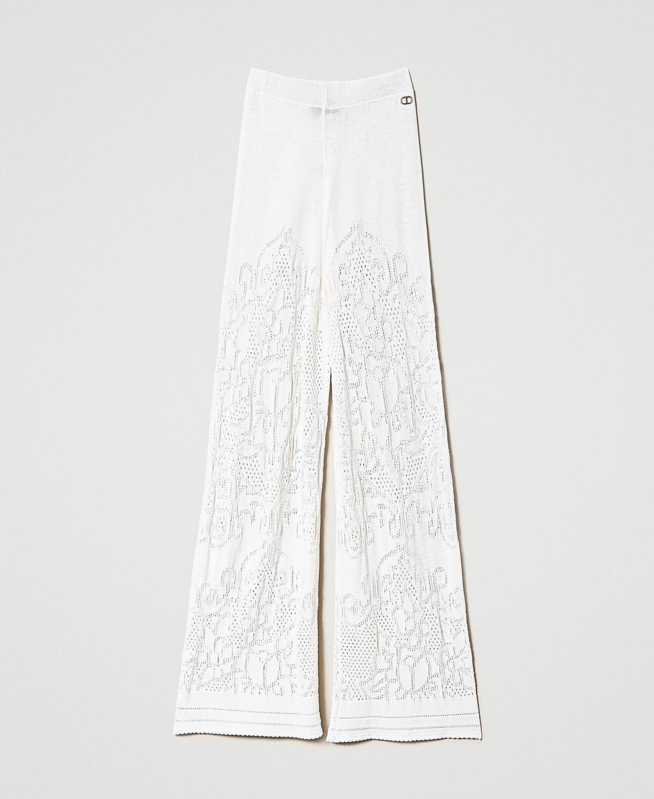 Pantalon palazzo avec fleurs ajourées