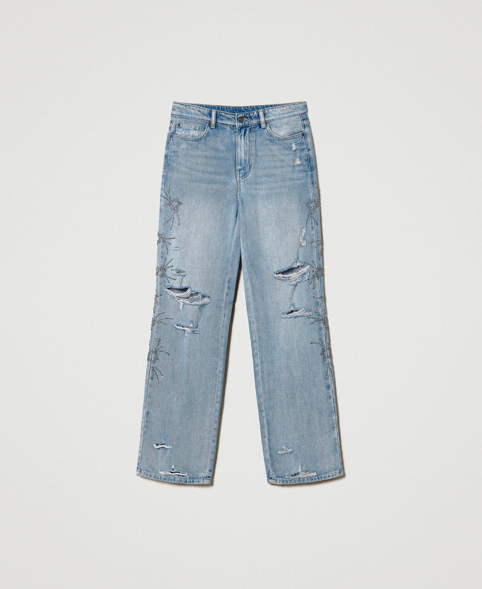 Jeans con strappi e ricami