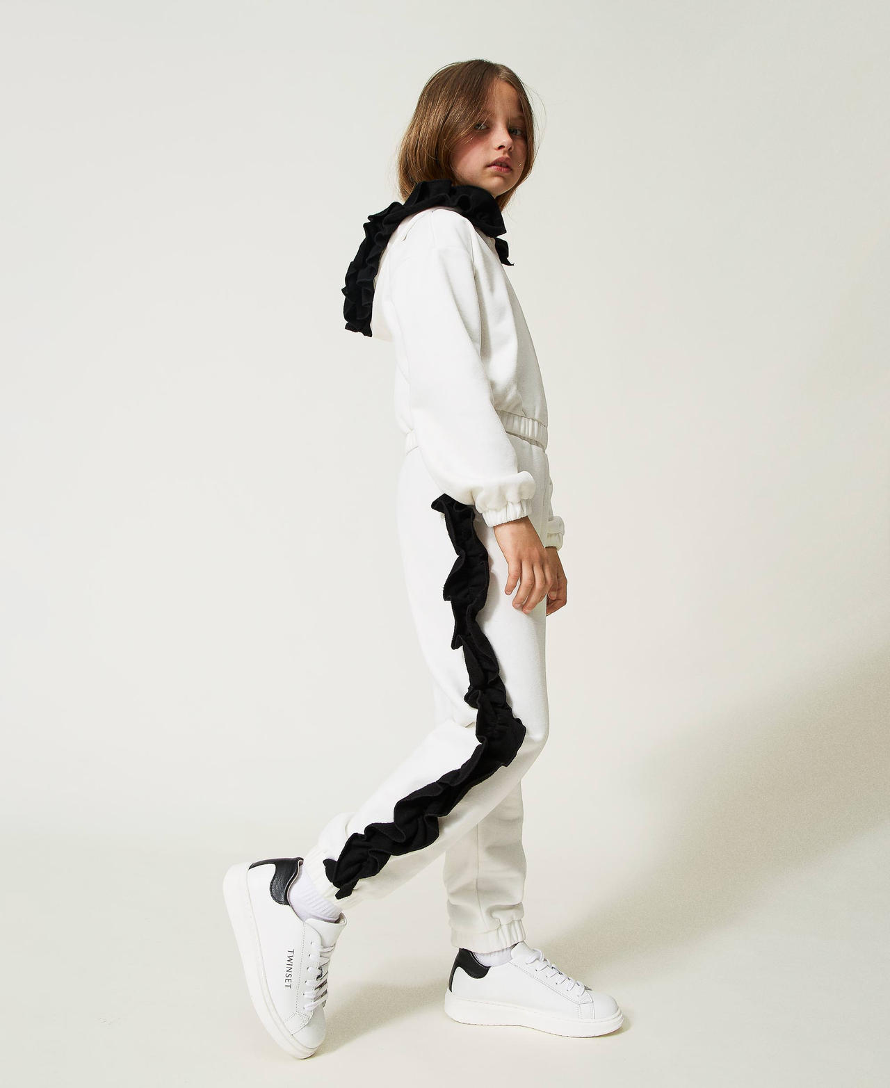 Plush fabric trousers with ruffles