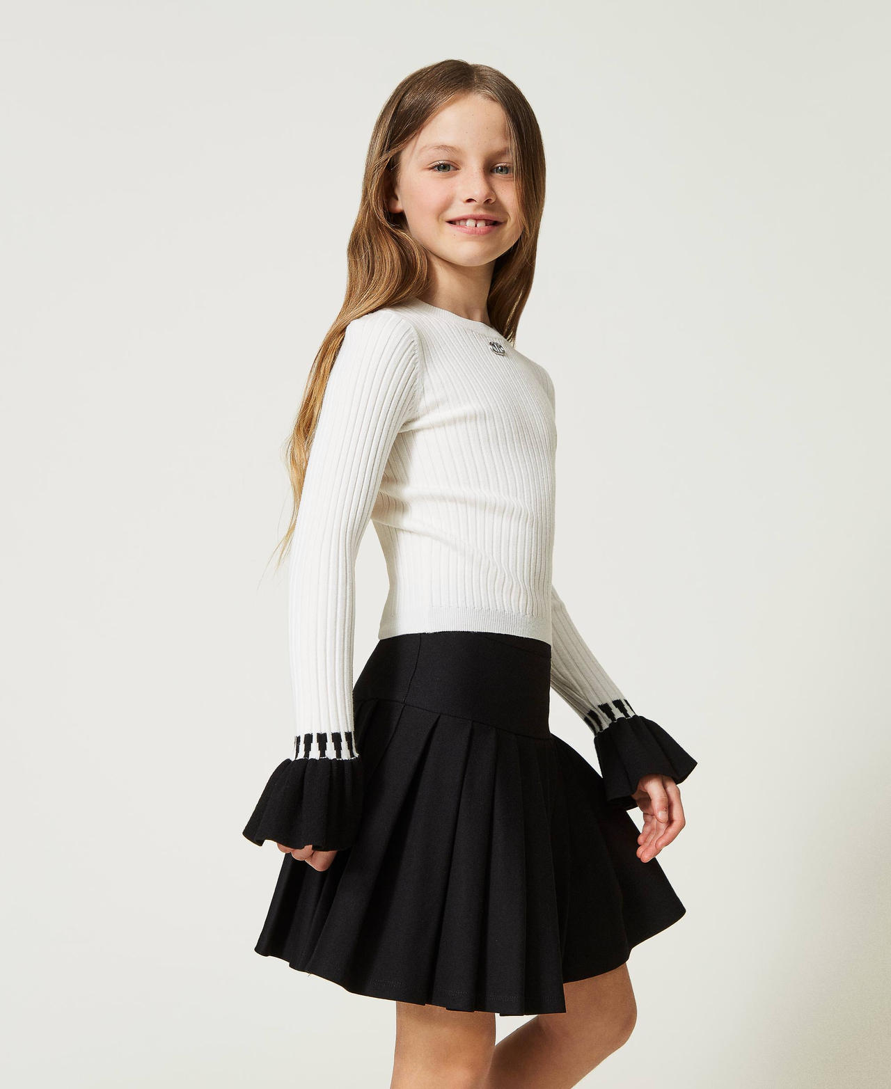 Ribbed jumper with flounces