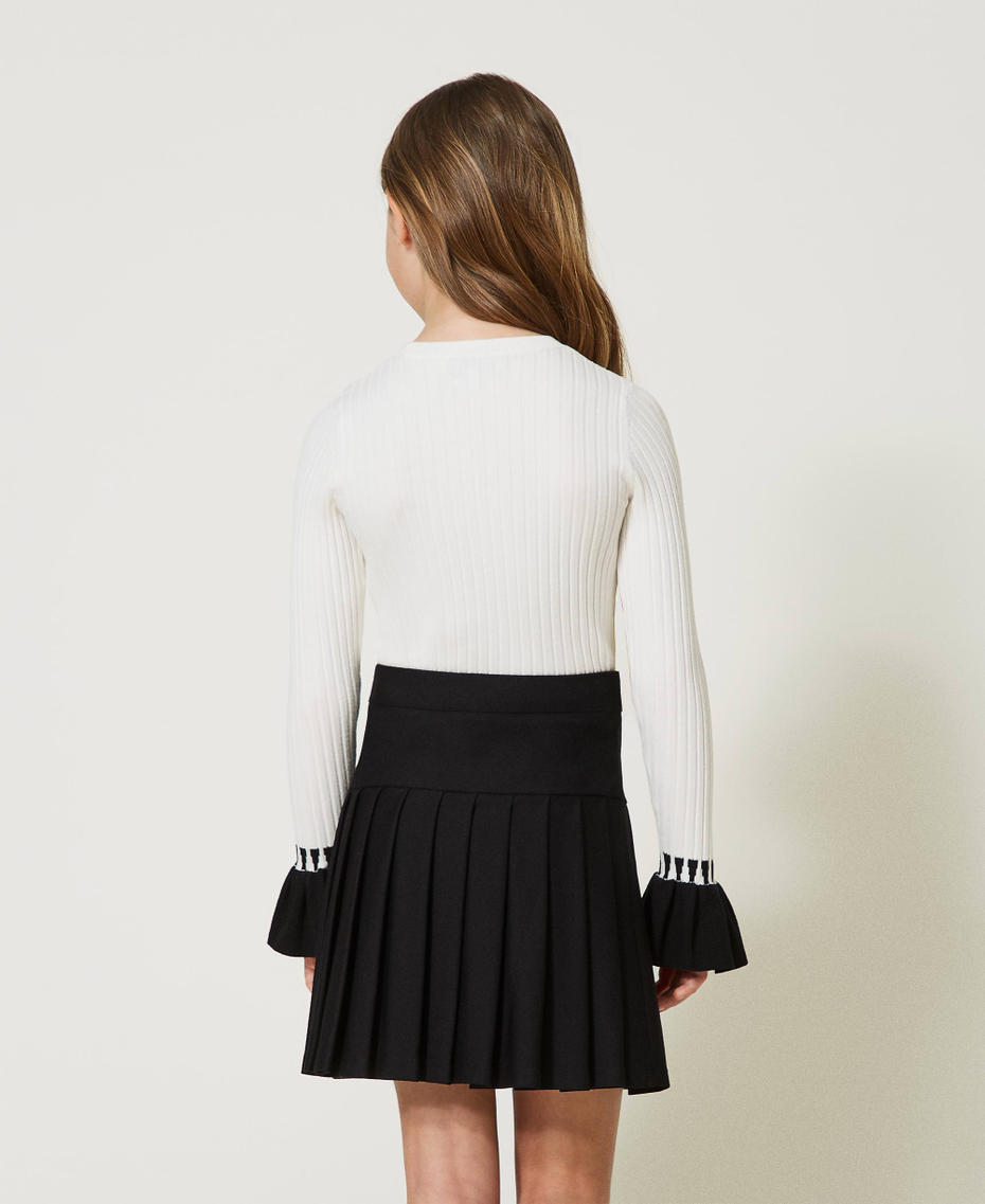 Ribbed jumper with flounces