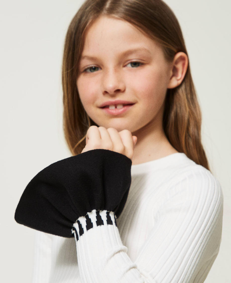 Ribbed jumper with flounces
