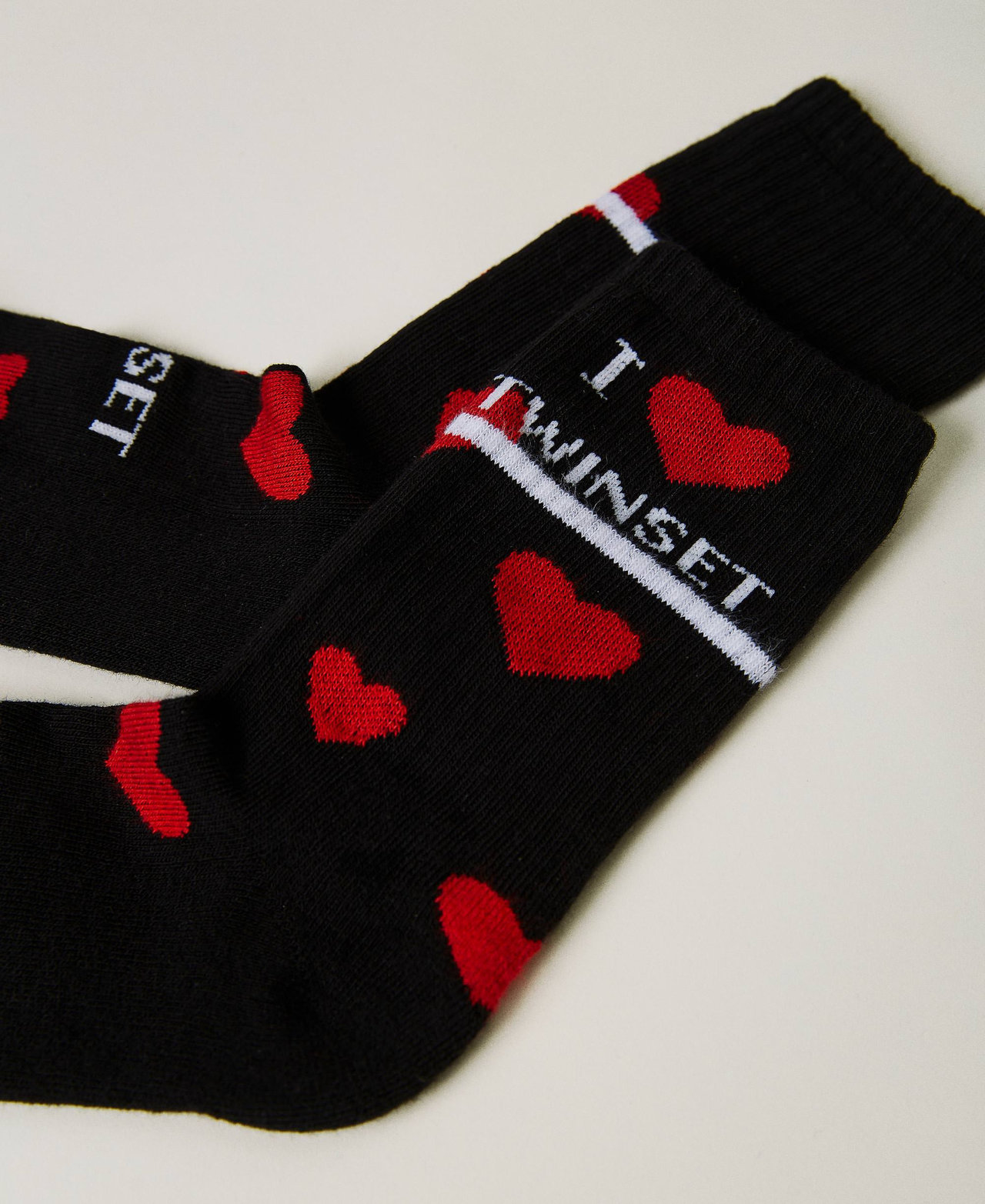 Long socks with jacquard hearts Black Girl 232GJ4381-02