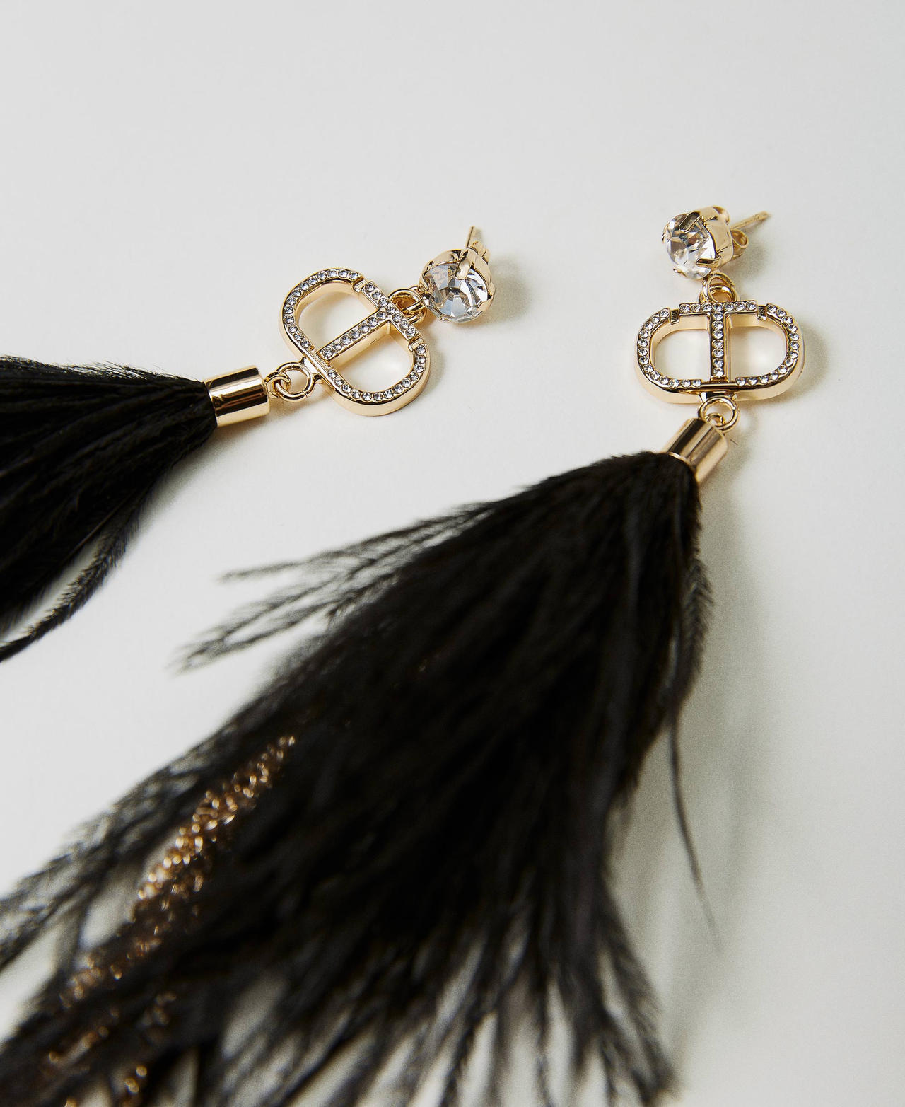 Orecchini con piume e frange