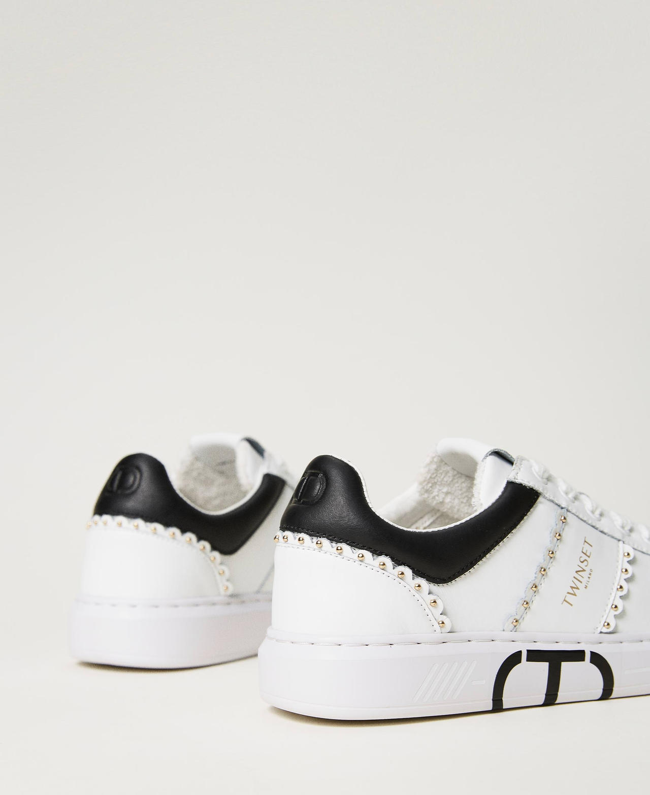 Leather trainers with studs and scalloping Bicolour Off White / Black Woman 232TCP220_02722_03