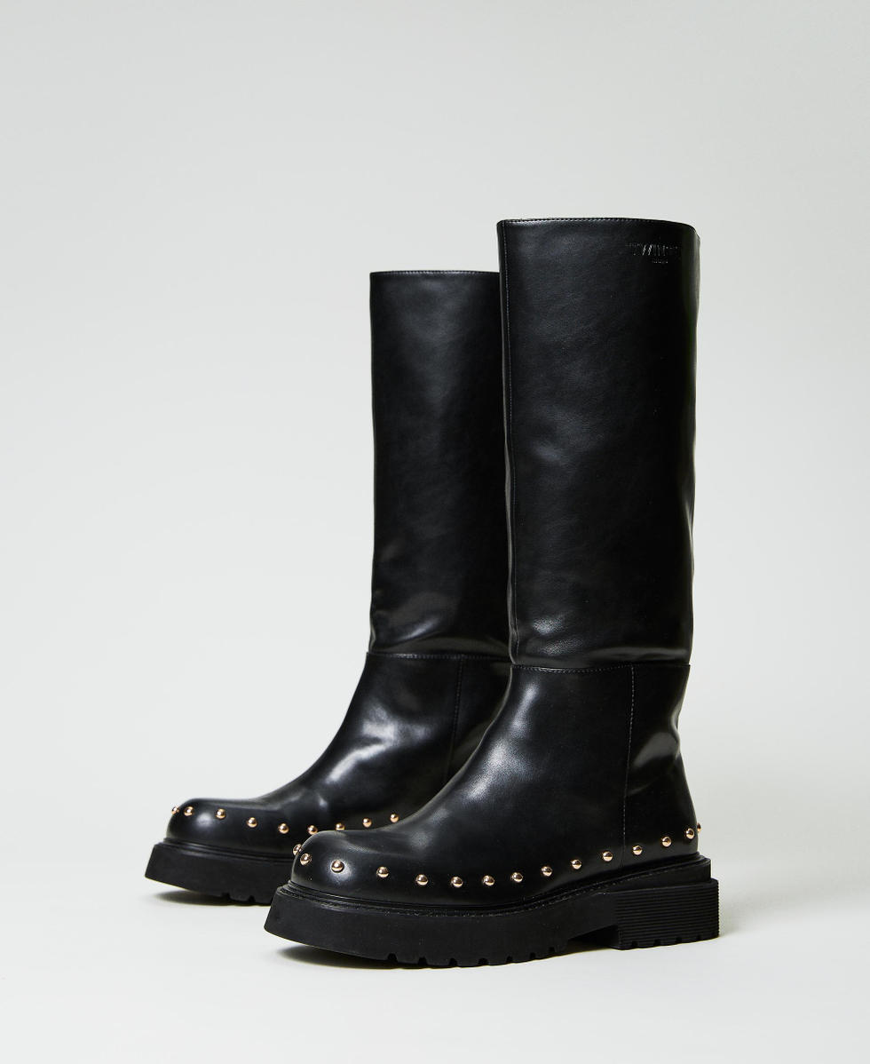 Black boots with studs around sole sale