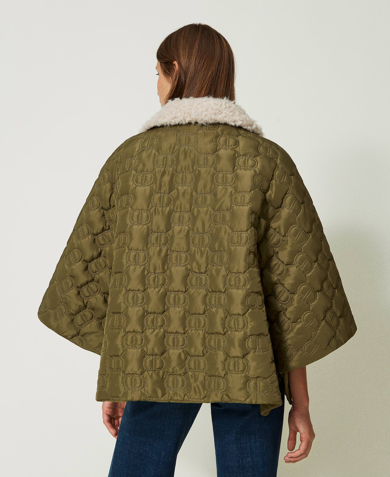 Quilted cape with Oval T