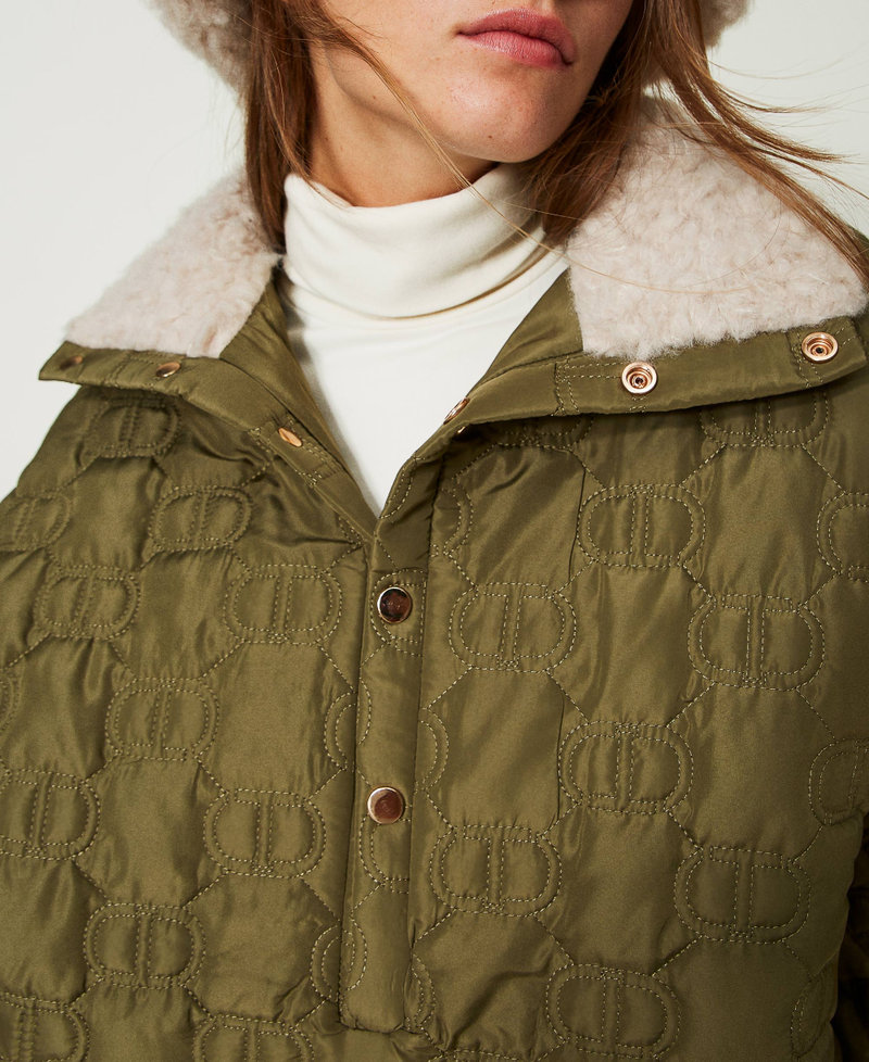 Quilted cape with Oval T