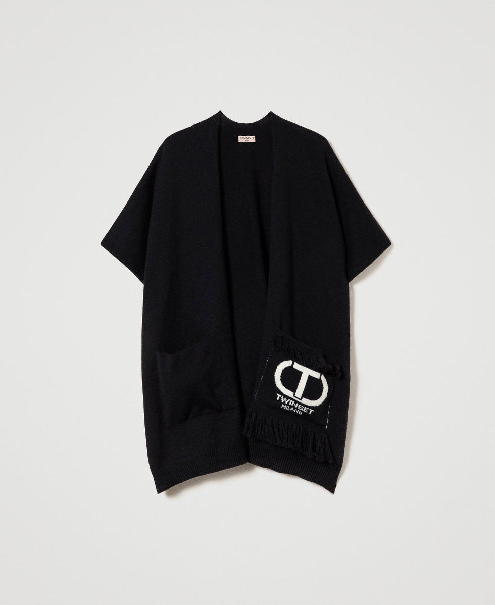 Open poncho with logo and fringes
