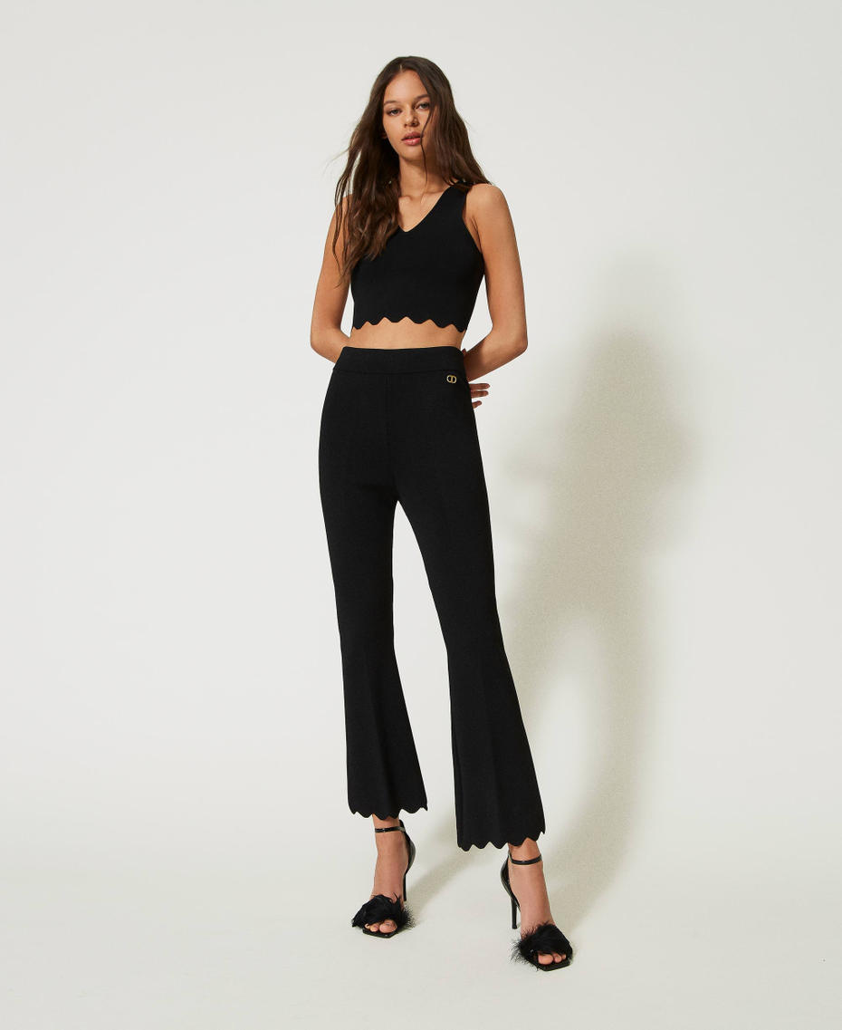 Flared knit trousers with scalloped hem