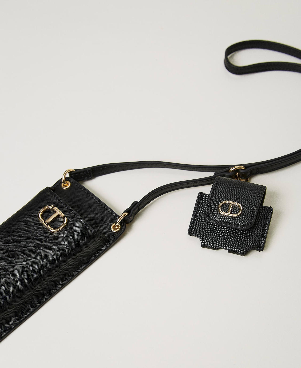 Smartphone and ear pod holder with Oval T