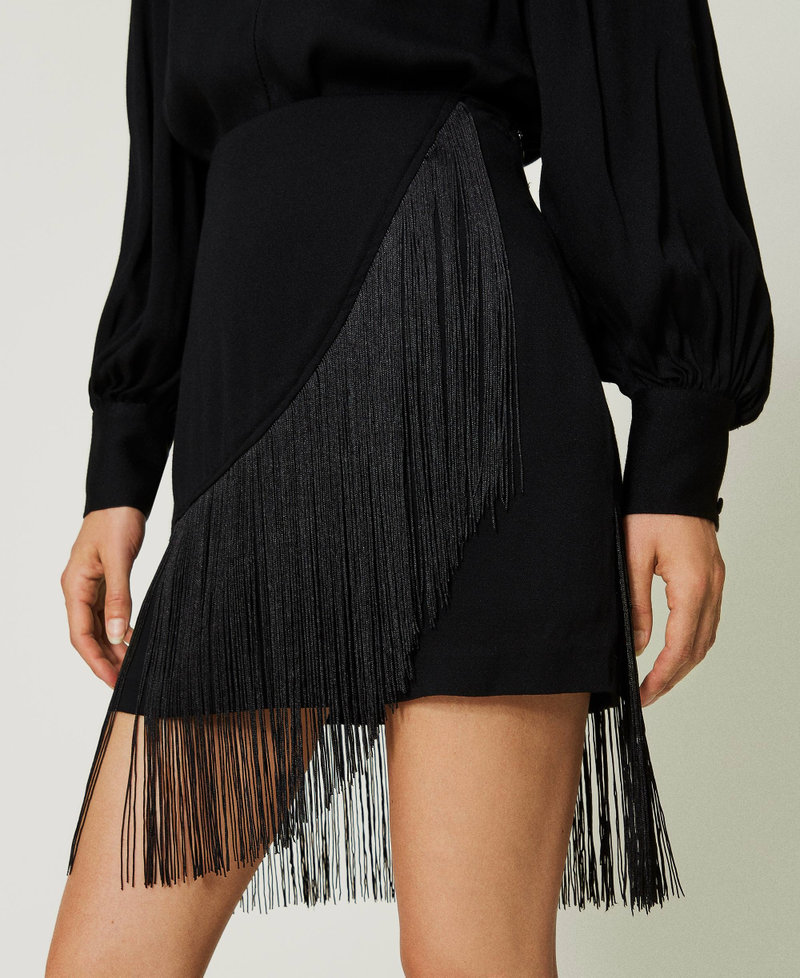 Crêpe miniskirt with fringes
