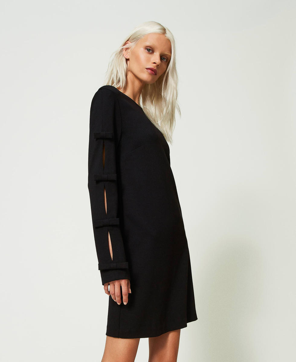 Short dress with small bows